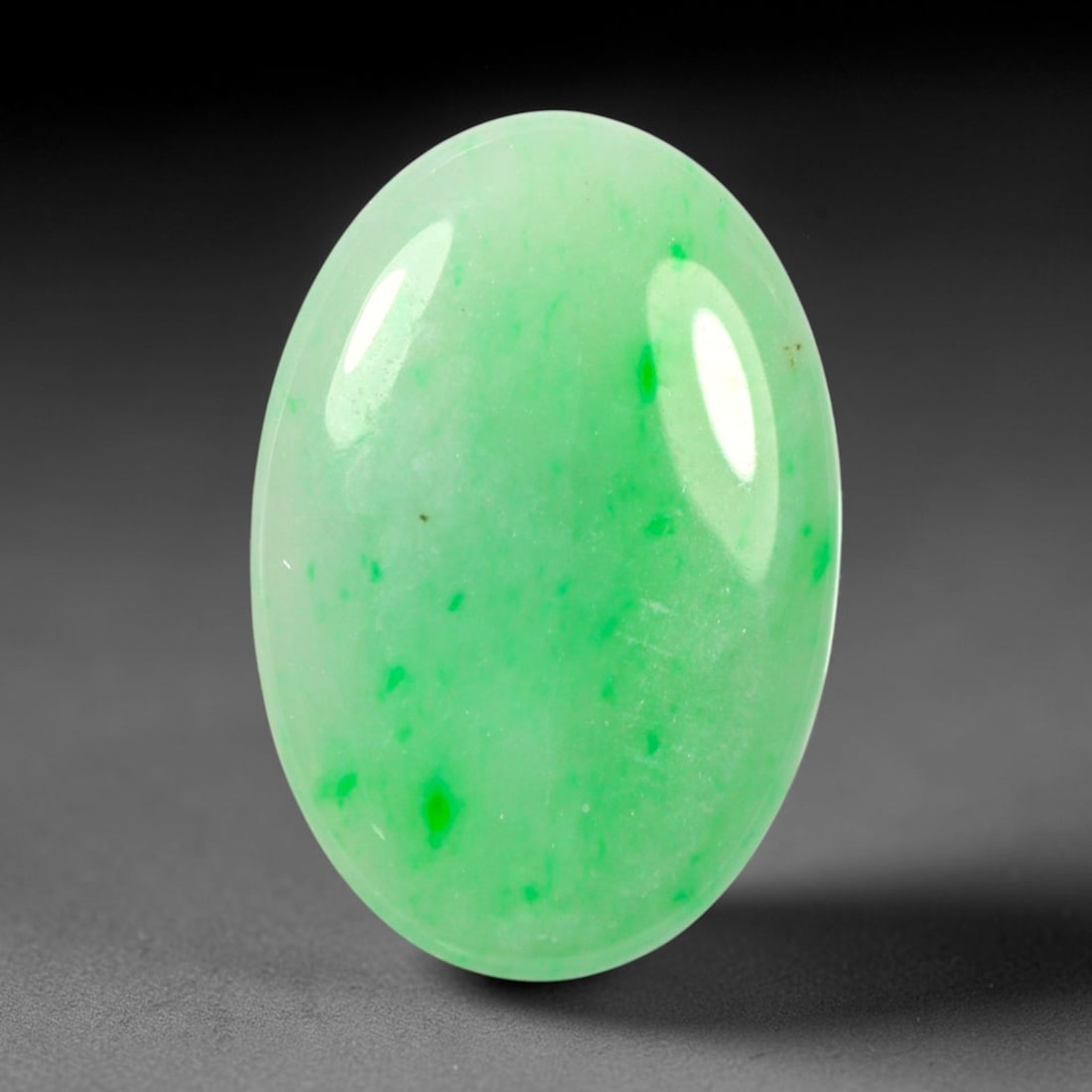 6.13ct Natural Burmese Type A Apple Green Jadeite Jade Cabochon, 88BP: This single loose natural Burmese Type A jadeite jade cabochon weighs exact dimensions of 18x12.3x3mm. It is completely untreated, free of artificial dye, bleaching, or resin filling, preserving the o
