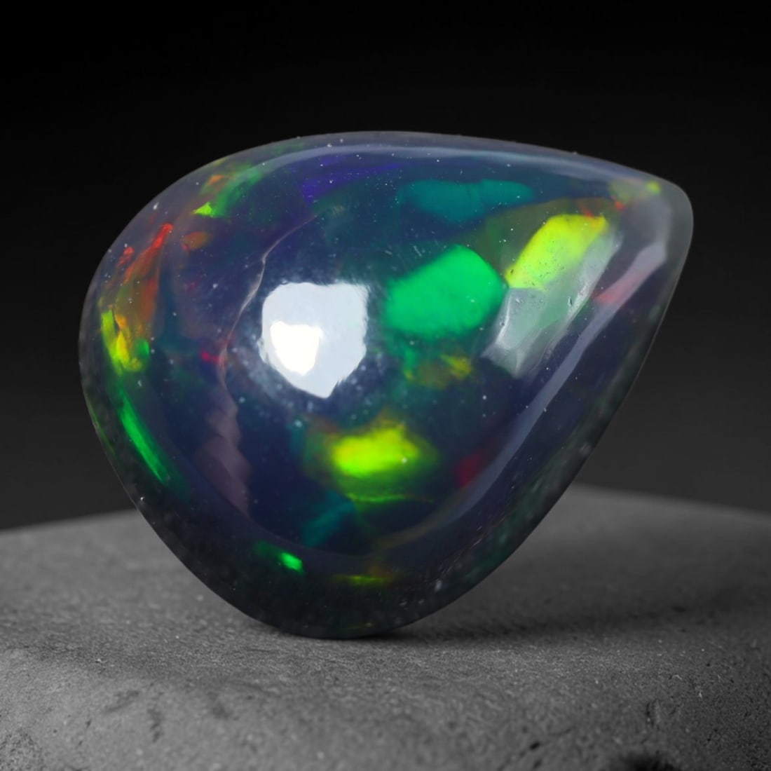 3.14ct Natural Ethiopian Welo Black Smoked Opal Cabochon Loose Gemstone, 41BY: This fully polished Ethiopian Welo opal features a dark smoked base with vivid, sweeping play-of-color shifting across its glossy dome surface, measured at 12x9x6mm. The black smoke treatment deepens 