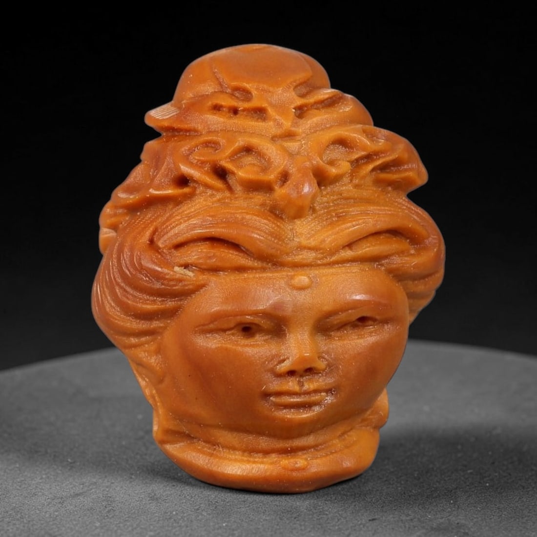 A Chinese Carved Natural Olive Nut Drilled Art Bead, 31BZ: Traditional craft bead carved from solid natural olive nut core, representing a classic miniature Chinese micro-carving folk art piece with a pre-drilled suspension bore integrated for easy threading 