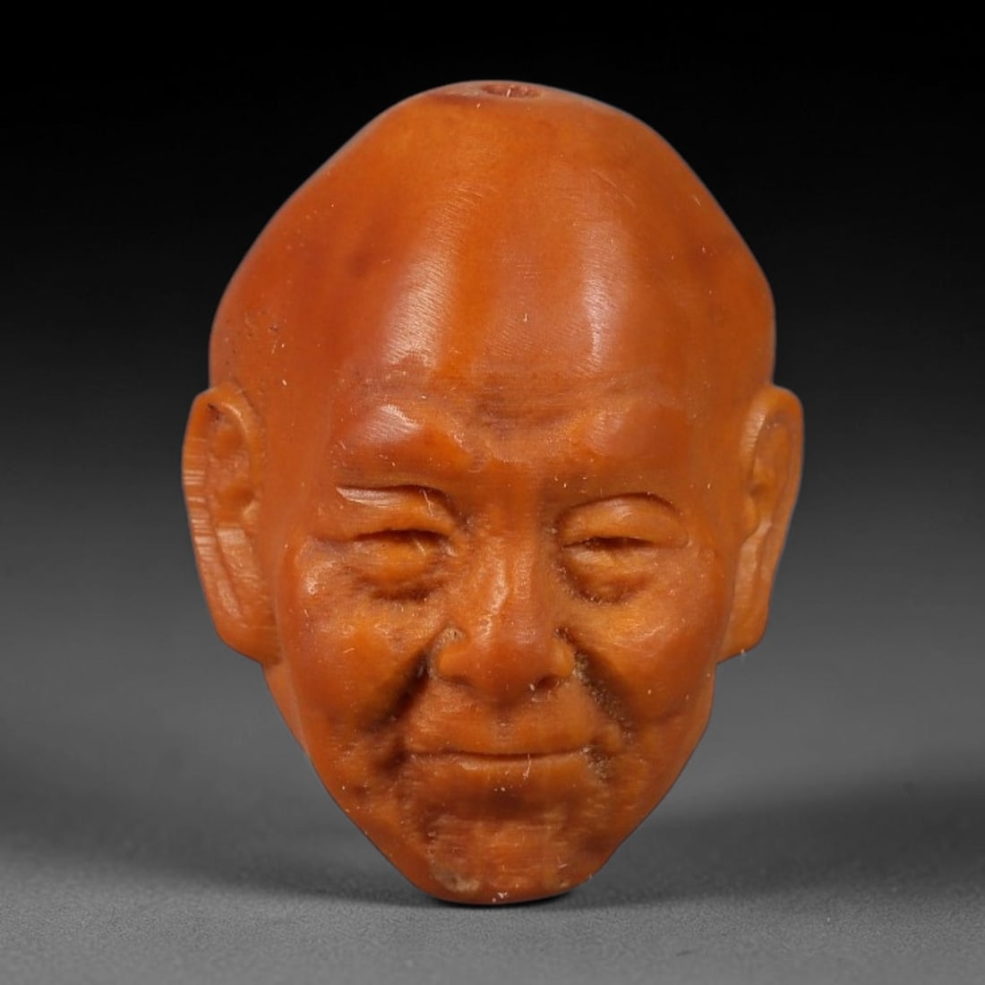 A Chinese Carved Natural Olive Nut Drilled Art Bead, 44BZ: Traditional craft bead carved from solid natural olive nut core, representing a classic miniature Chinese micro-carving folk art piece with a pre-drilled suspension bore integrated for easy threading 