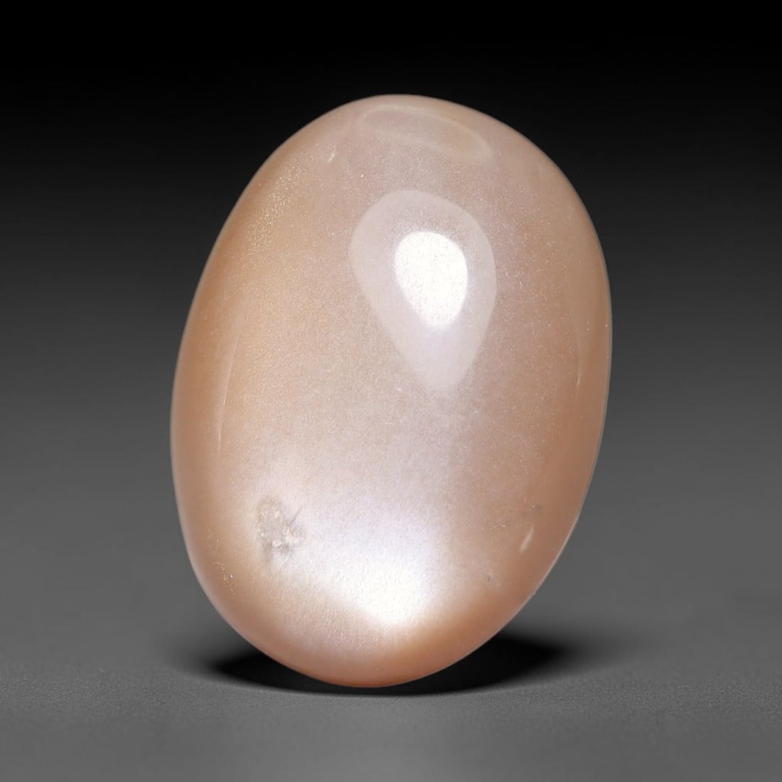 7.40ct Natural Ceylon Warm Peach Moonstone Loose Gemstone, 86FX: This natural Ceylon moonstone has dimension measurements of 16x12x5mm, showcasing a smooth warm peach base tone paired with subtle soft adularescent sheen that glides gently across the polished surfac