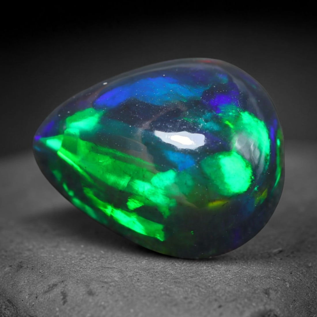 4.39ct Natural Ethiopian Welo Black Smoked Opal Cabochon Loose Gemstone, 55BY: This fully polished Ethiopian Welo opal features a dark smoked base with vivid, sweeping play-of-color shifting across its glossy dome surface, measured at 13x10x7mm. The black smoke treatment deepens