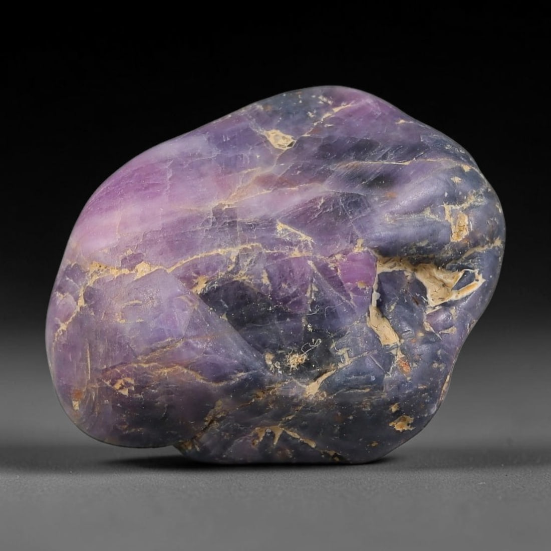 36.36ct Natural Unheated Sri Lankan Purplish Blue Sapphire Rough, 39FC: This natural corundum rough is an unheated purplish blue sapphire sourced from Sri Lankan alluvial gem deposits, featuring an irregular natural native form with residual pale yellow-brown mineral matr