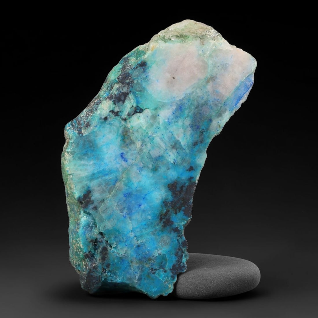 200ct Natural Peruvian Chrysocolla Polished Slab Rough, 68AR: This partial-polished chrysocolla slab features blended mineral matrix with smooth refined face and unaltered natural rugged edge across its 57x26x16mm elongated form, translucent mineral layers hold 