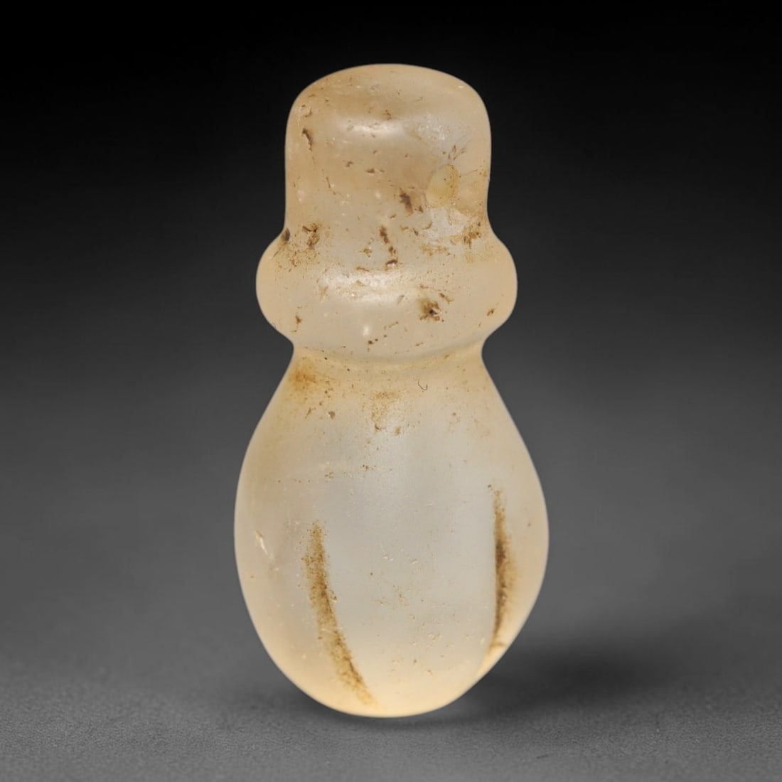 Ancient Medieval Coptic Christian Egyptian Culture Rock Crystal Amulet (300-1000 CE), 23FY: This antique rock crystal amulet originates from Coptic Christian Egyptian Culture, a region with a long-standing tradition of crafting translucent hardstone talismans for devotional and funerary use.
