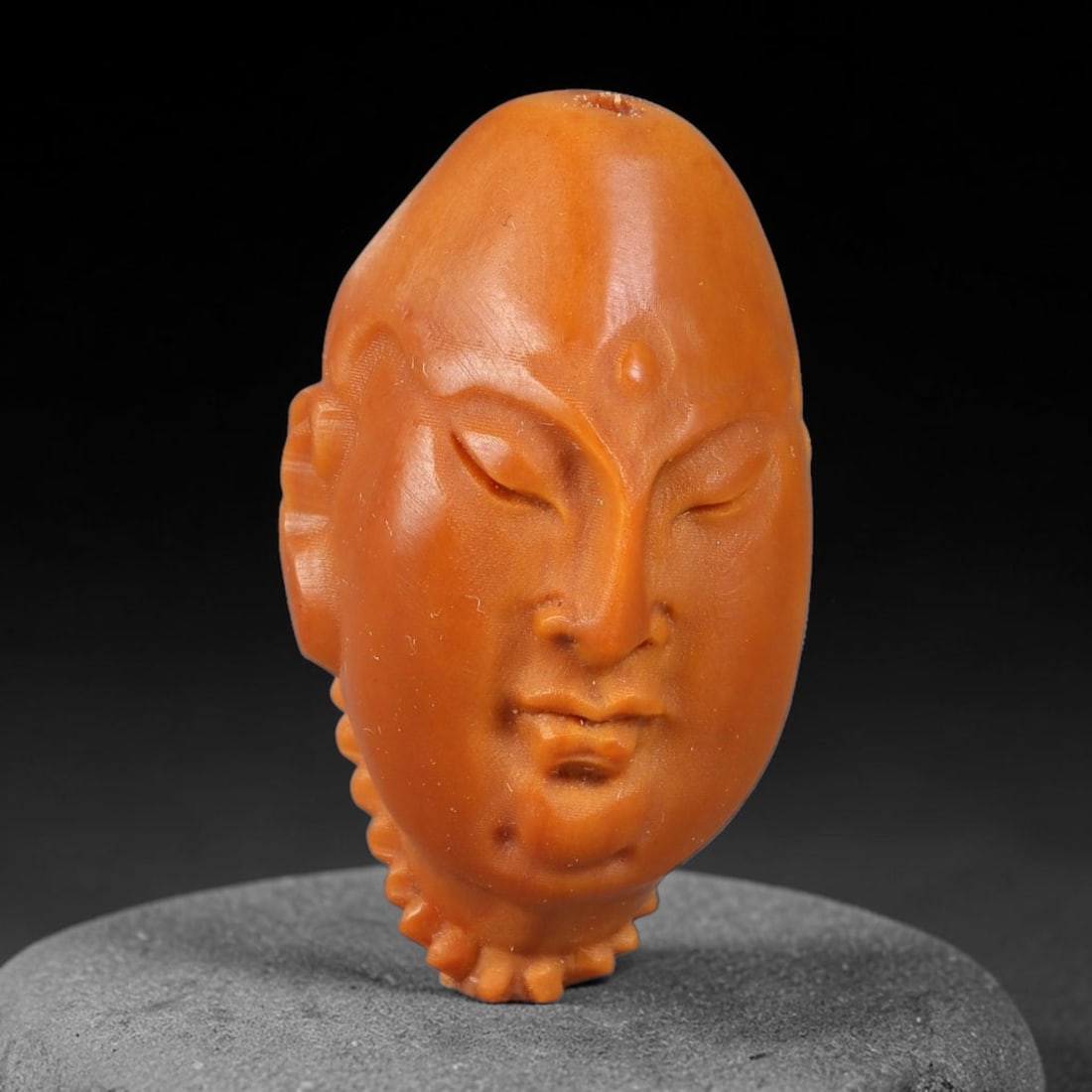 A Chinese Carved Natural Olive Nut Drilled Art Bead, 23BZ: Traditional craft bead carved from solid natural olive nut core, representing a classic miniature Chinese micro-carving folk art piece with a pre-drilled suspension bore integrated for easy threading 