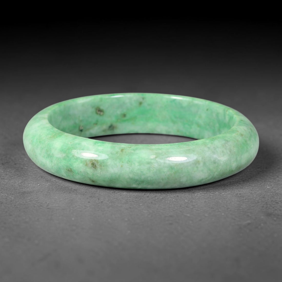 Natural Burmese Type A Jadeite Jade Bangle Bracelet, 68BK: Polished untreated Burmese Type A jadeite jade bangle bracelet with a 61 mm inner diameter and a 14 mm band width. Crafted into a classic rounded interior flat exterior shape with smooth continuous hi