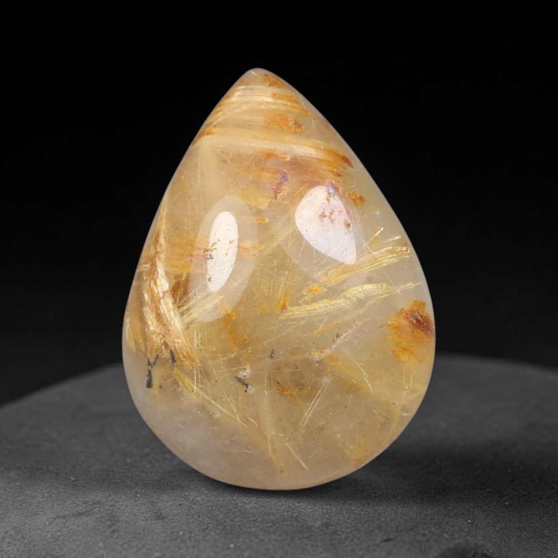 9.16 Carats Natural Brazil Golden Needle Rutile Quartz Loose Gemstone, 62FG: This Brazil golden needle rutile quartz cabochon measures 17.3x12.8x5.8mm, featuring prominent bright golden rutile needle inclusions scattered naturally throughout its clear transparent quartz base, 