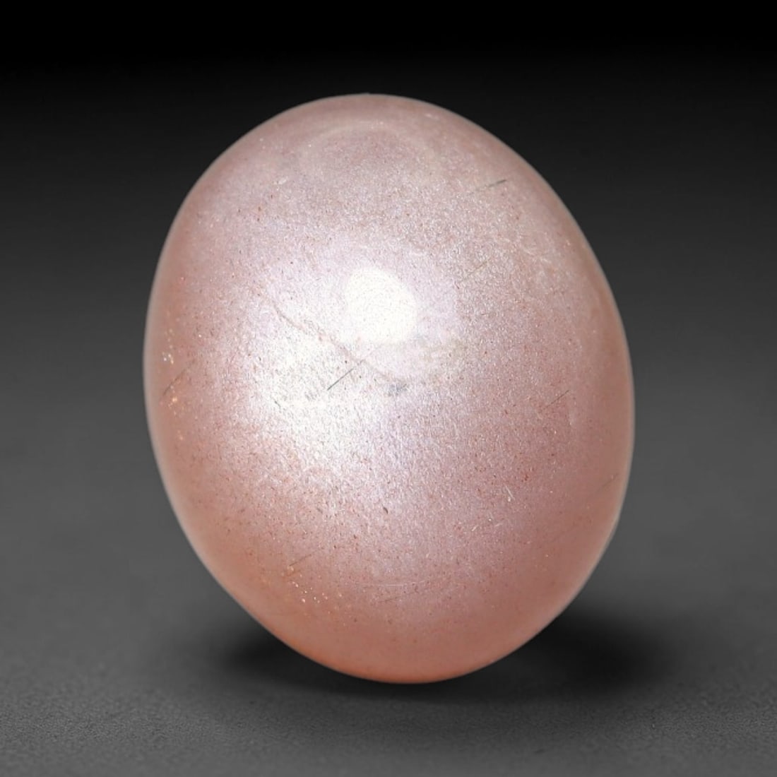 7.52ct Natural Ceylon Warm Peach Moonstone Loose Gemstone, 83FX: This natural Ceylon moonstone has dimension measurements of 13x11x7mm, showcasing a smooth warm peach base tone paired with subtle soft adularescent sheen that glides gently across the polished surfac