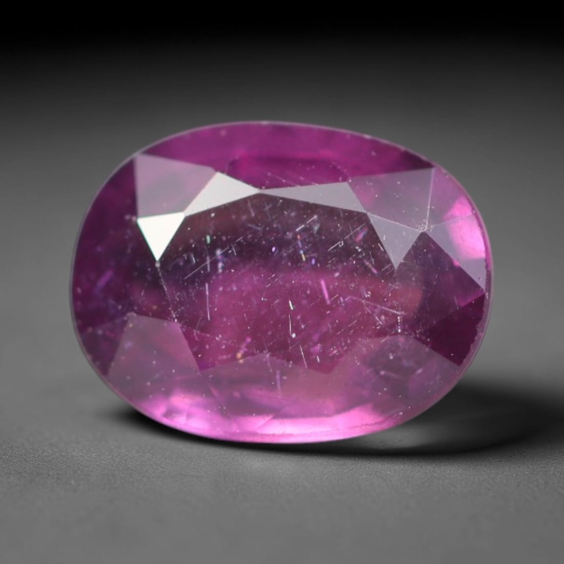 1.11ct Natural Tanzanian Rhodolite Grape Garnet Faceted Loose Gemstone, 88BA: This expertly faceted grape garnet, a scarce saturated purple-magenta rhodolite variant, features transparent crystal structure dotted with faint microscopic mineral specks within its precisely cut re