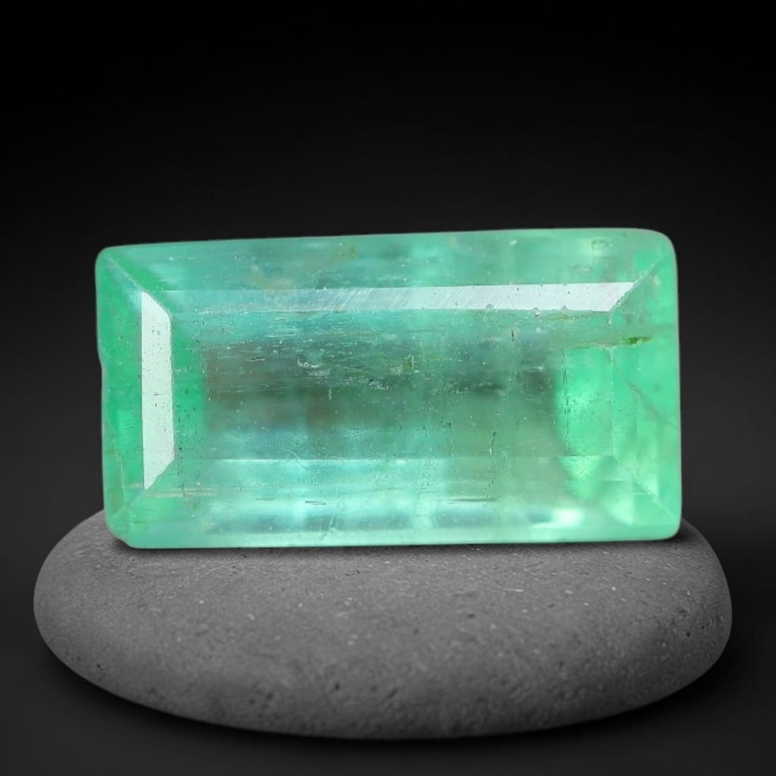 0.93 Carats Natural Zambian Green Emerald Loose Gemstone, 10FP: This green Zambian emerald holds smooth even saturation with subtle faint natural internal markings lending authentic organic character, measured at 8.2x4.3x3.2mm, its calm cool green tone delivers un