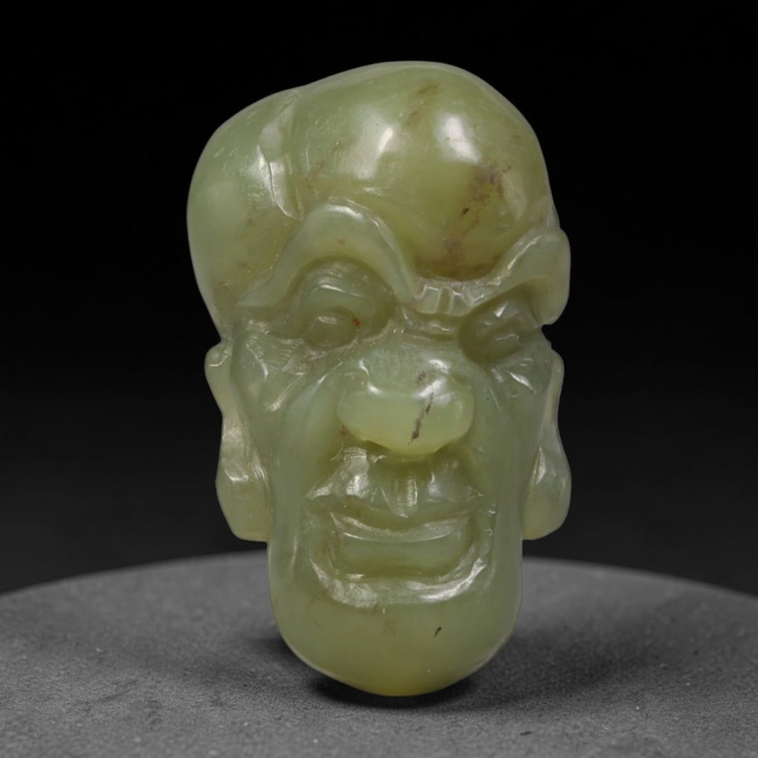 Natural Vintage Chinese Nephrite Jade Pale Yellow-Green Smiling Arhat Head Carved Face Bead, 32AP,,: Hand-carved vintage Chinese strung bead made from natural vintage Chinese nephrite jade, sized 3cm x 1.8cm. This barrel-shaped bead is fully sculpted as a cheerful Buddhist Arhat facial bust, featurin