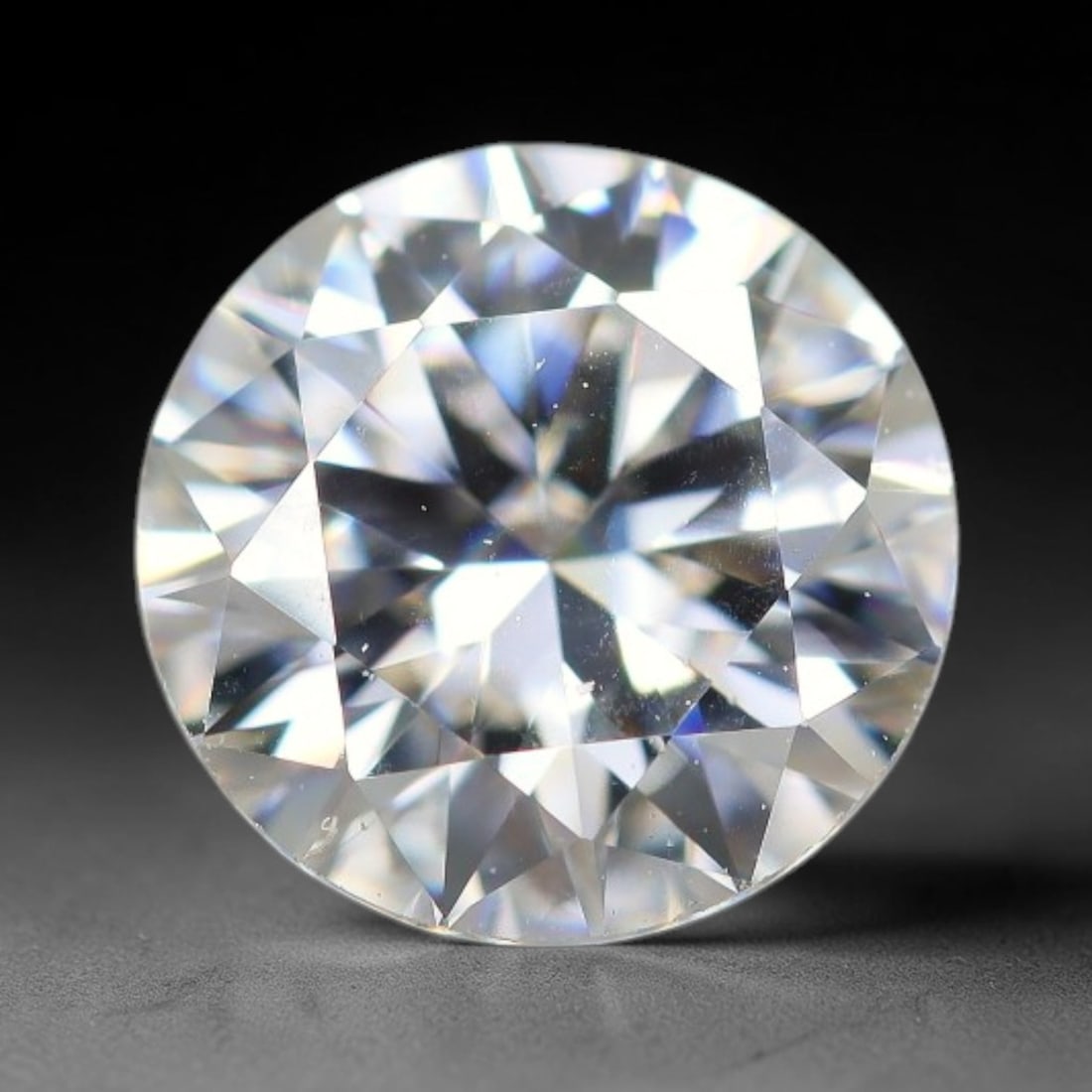 0.94 Carats Natural Clear White Moissanite Loose Gemstone, 45FE: This clear white moissanite carries dimension specs of 5.8x3.8mm, exhibiting outstanding light dispersion that produces vivid, multi-faceted sparkle across its transparent body, with sparse tiny micro