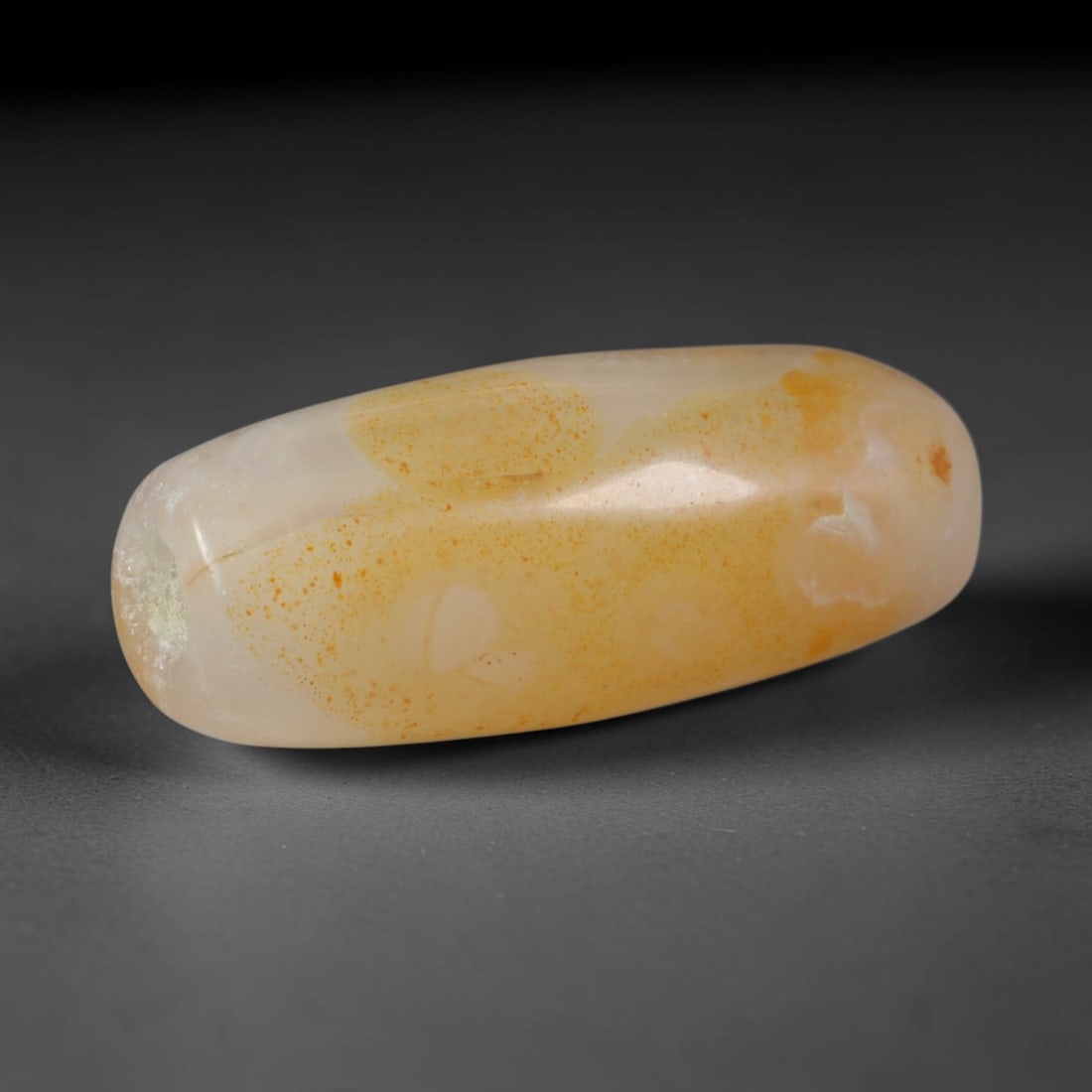 Ancient Sogdian Culture Banded Agate Barrel Bead (500 BCE-800 CE), 47AD: This antique banded agate barrel bead originates from Sogdian Culture, the preeminent Silk Road merchant civilization that operated agate bead workshops to trade stone adornments between China, Persia