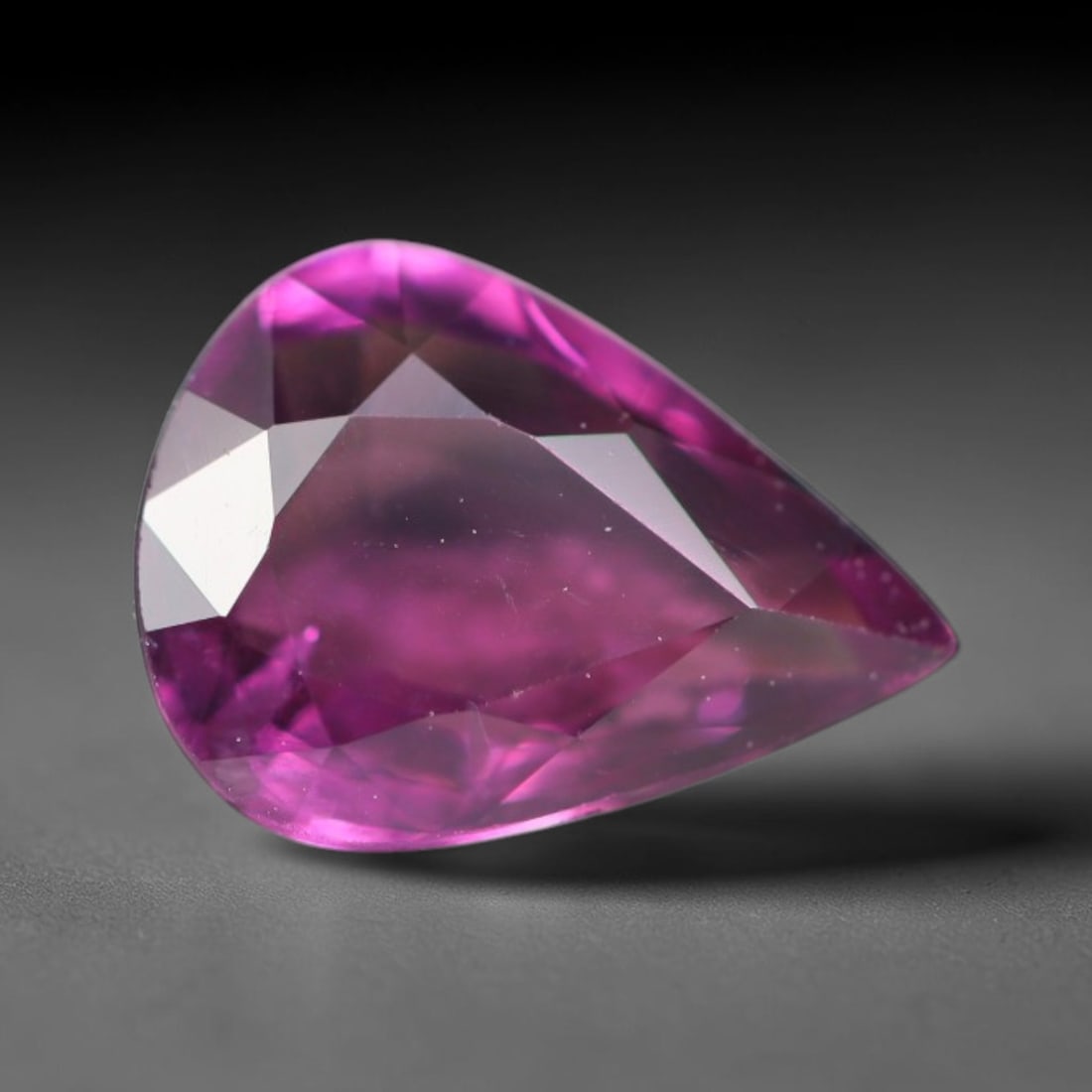 1.09ct Natural Tanzanian Rhodolite Grape Garnet Faceted Loose Gemstone, 82BA: This expertly faceted grape garnet, a scarce saturated purple-magenta rhodolite variant, features transparent crystal structure dotted with faint microscopic mineral specks within its precisely cut re