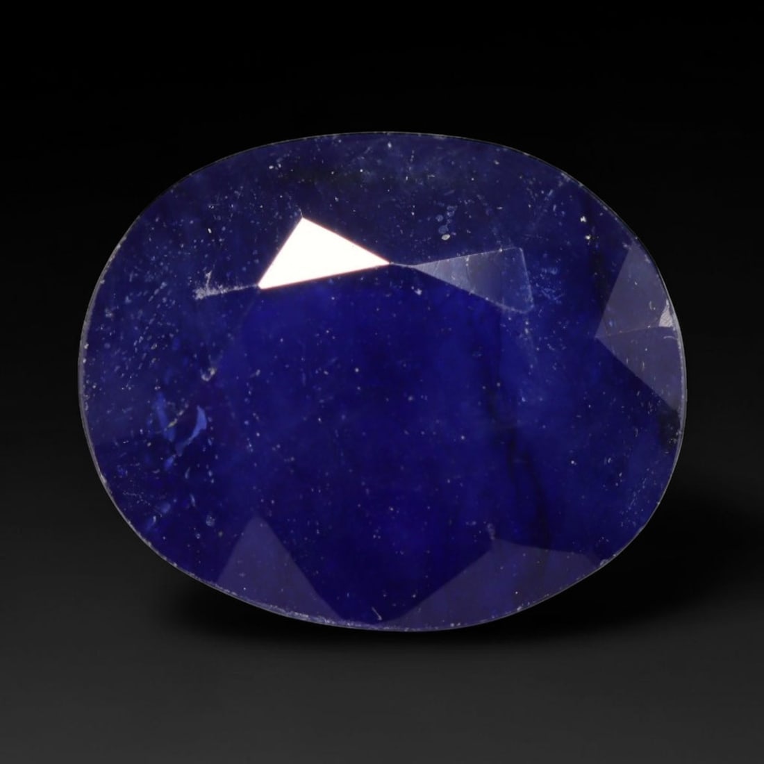 4.05ct Natural Madagascar Blue Sapphire Oval Faceted Loose Gemstone, 100BZ: This expertly faceted oval gemstone is natural blue sapphire sourced from Madagascar. It features rich deep royal blue colour throughout the crystal matrix, with characteristic fine mineral specks and