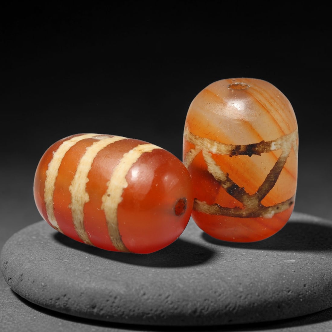 Ancient Medieval Burmese Pagan & Ava Kingdoms Etched Carnelian Barrel Beads (849-1555 CE), 33FY: This pair of antique etched carnelian barrel beads originates from the Medieval Burmese Pagan & Ava Kingdoms, whose etched carnelian bead craft continued to produce trade specimens circulated widely t