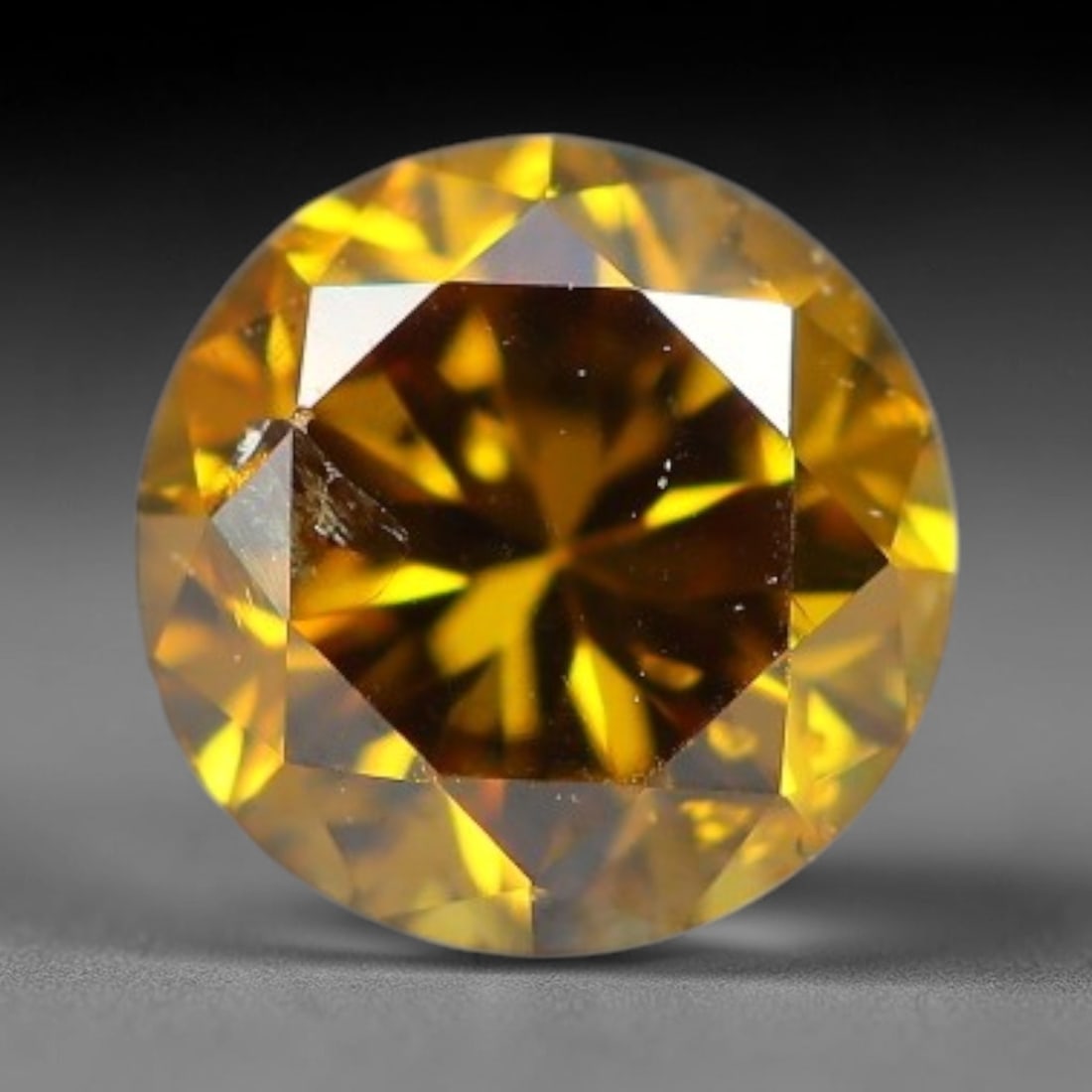 0.18ct Round Natural Fancy Deep Golden Yellow Diamond Loose Gemstone, 40BH: This polished natural round fancy diamond boasts rich deep golden yellow saturation, dotted with fine microscopic native mineral specks within its crystalline interior, measured at calibrated dimensio
