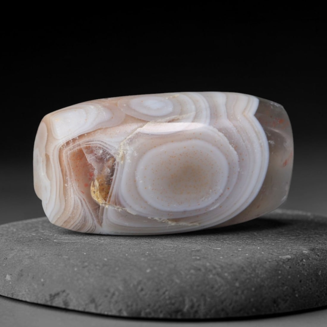 Ancient Kushan Empire Dual Natural Eye Banded Agate Barrel Bead (30 BCE - 375 CE), 73AD: This antique dual-eye banded agate barrel bead originates from the Kushan Empire, a pivotal Silk Road cross-cultural civilization renowned for crafting talismanic eye agate beads revered for protectiv