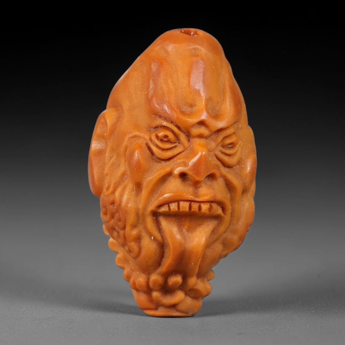 A Chinese Carved Natural Olive Nut Drilled Art Bead, 22BZ: Traditional craft bead carved from solid natural olive nut core, representing a classic miniature Chinese micro-carving folk art piece with a pre-drilled suspension bore integrated for easy threading 