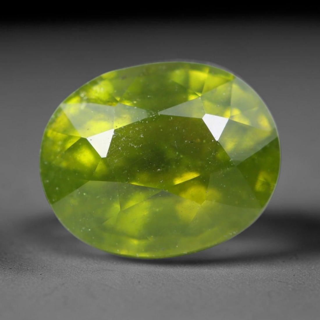 2.47ct Natural Mexican Lime Green Faceted Sphene Loose Gemstone, 55BA: This precisely faceted sphene exhibits vivid translucent lime green body tone, featuring fine natural mineral veils and tiny scattered crystalline micro-inclusions trapped within its high-refractive c