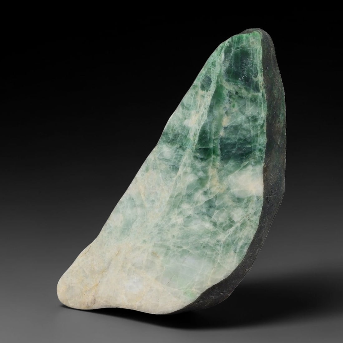 300ct Natural Type A Burmese Jadeite Jade Sliced Rough, 4AZ: This specimen is a sliced rough block of natural Type A Burmese jadeite jade. The interior displays natural colour zoning with visible mineral veining and crystalline patterns typical of unprocessed j