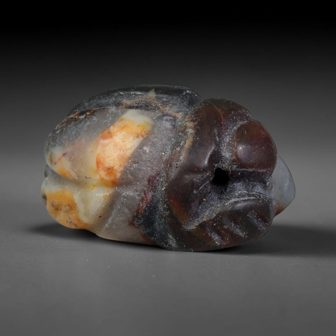 Ancient Pharaonic Egyptian Agate Scarab Amulet Bead (3100 BCE-30 CE), 33EC: This antique scarab amulet bead is carved from natural agate, originating from Pharaonic Egyptian culture. Scarabs were sacred protective talismans closely linked to rebirth and eternal life within an