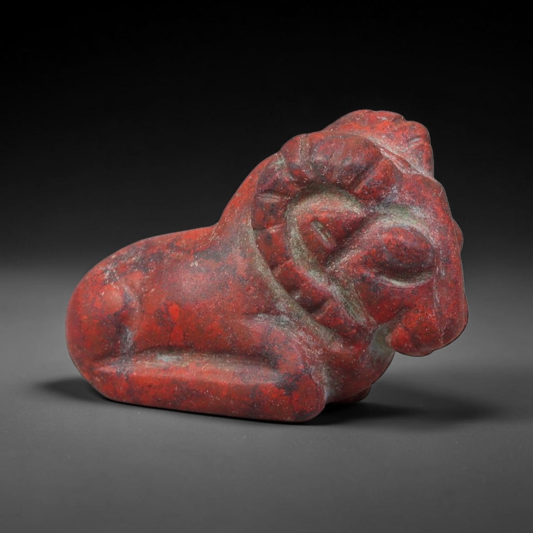 Ancient Sasanian Persian Empire Red Jasper Recumbent Ram Amulet (224-651 CE), 58FV: This carved red jasper recumbent ram amulet originates from the Sasanian Persian Empire, renowned for crafting zoomorphic talismans symbolising vitality, fertility and divine protection within Zoroast