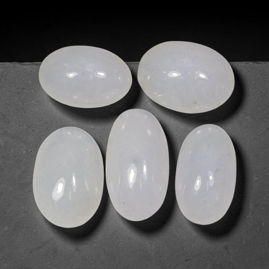 22.46ct Natural Burmese Type A Icy Grade Jadeite Jade Cabochon Loose Gemstone Lot, 62FV: This natural Burmese Type A jadeite jade cabochon lot features attractive icy translucent body with smooth polished surfaces. Dimensions measure 13x9x4mm, sourced from Myanmar, these polished cabochon