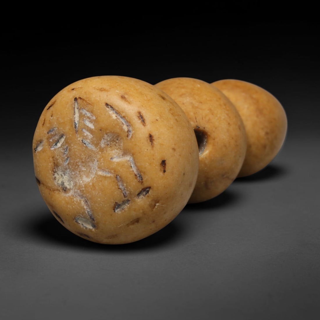 Ancient Sogdian Barrel Stamp Seal (500 BCE-800 CE), 11ED: This carved ochre stone barrel-shaped stamp seal originates from Sogdian Culture, the influential merchant civilization of the ancient Silk Road. The circular seal face features a deeply incised griff