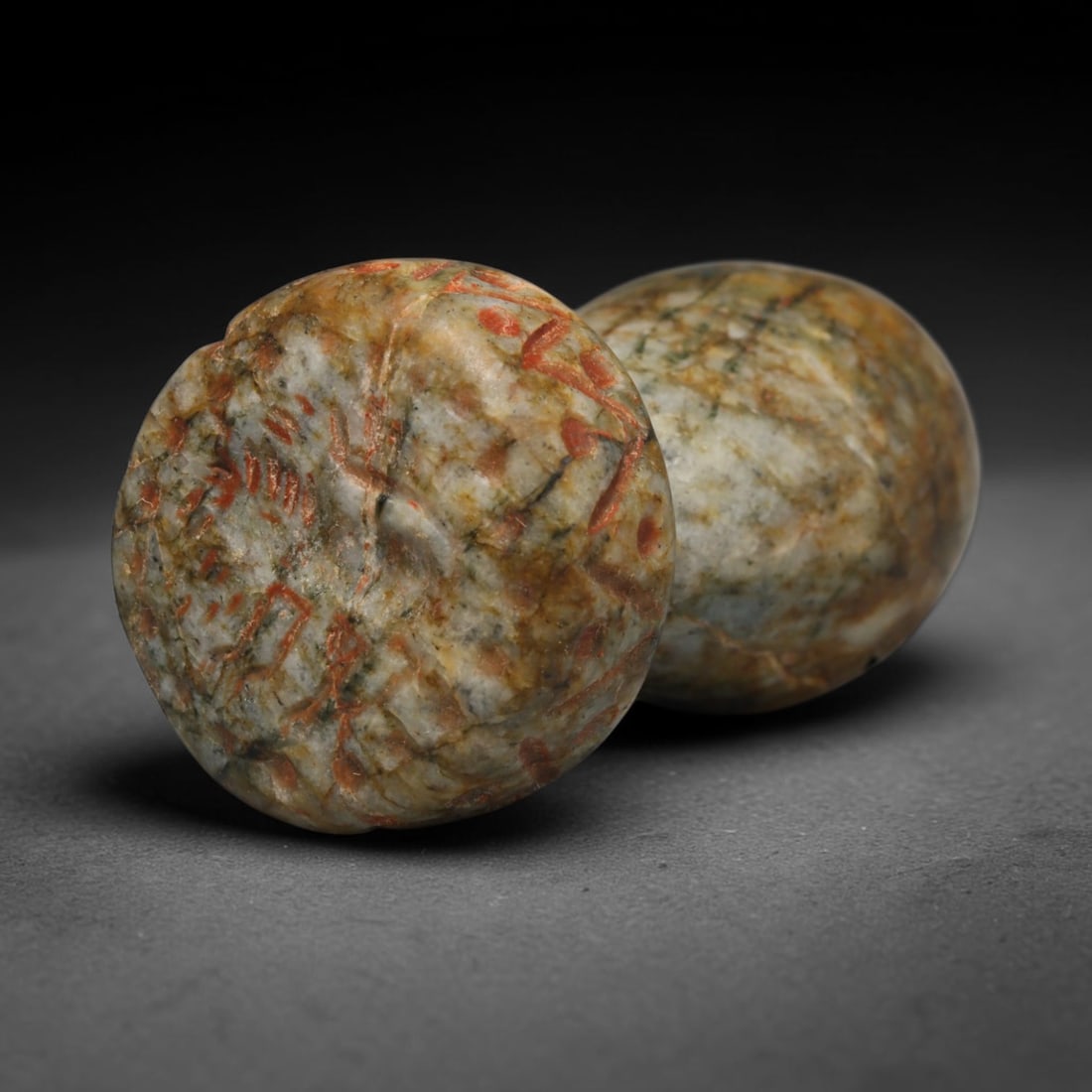 Ancient Sasanian Persian Double Form Stone Stamp Seal (c.224-651 CE), 47ED: This marbled multicolored stone stamp seal originates from Ancient Sasanian Persian culture. It features a distinctive double-tiered sculpted handle with a transverse suspension hole for wear as a por