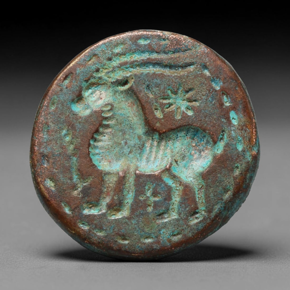 Ancient Sasanian Persian Bronze Intaglio Stamp Seal (224-651 CE), 57ED: This antique bronze stamp seal originates from the Sasanian Persian Empire, widely used for marking documents, goods and serving as a personal emblem in late antiquity. The circular face bears a zoomo