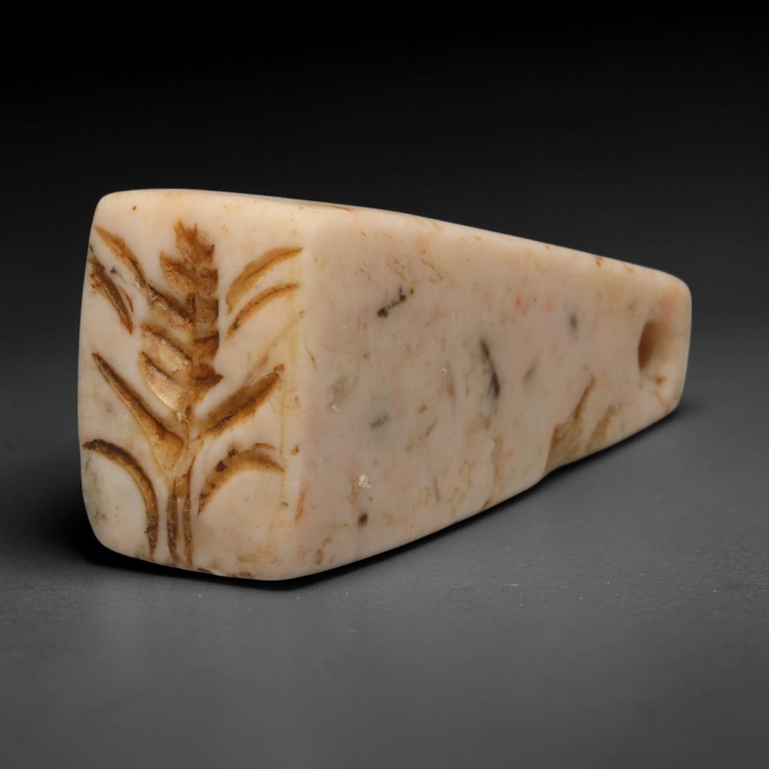 Ancient Sasanian Persian Tapered Stamp Seal with Wheat Motif (c.224-651 CE), 26ED: This pale mottled stone tapered stamp seal originates from Ancient Sasanian Persian culture. The rectangular sealing face displays an incised wheat sheaf symbol, an emblem of fertility and abundance i