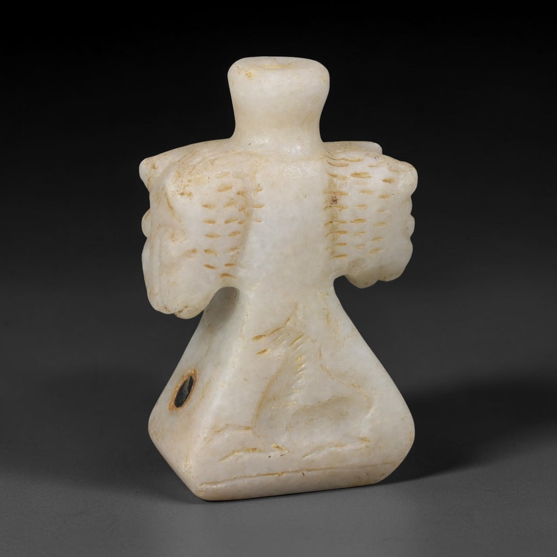 Ancient Syro-Hittite Marble Kohl Cosmetic Vessel (1200-800 BCE), 41EF: This ancient cosmetic kohl vessel is carved from pale marble, originating from Iron Age Syro-Hittite cultures of Northern Syria and Eastern Anatolia. The bottle features a distinctive double-headed wi