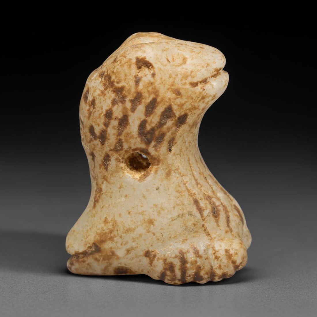 Ancient Sasanian Persian White Stone Double Zoomorphic Head Amulet (224-651 CE), 51ED: This antique weathered white stone double zoomorphic head amulet originates from Ancient Sasanian Persian civilisation. The artifact is sculpted with zoomorphic heads positioned at the upper and lower
