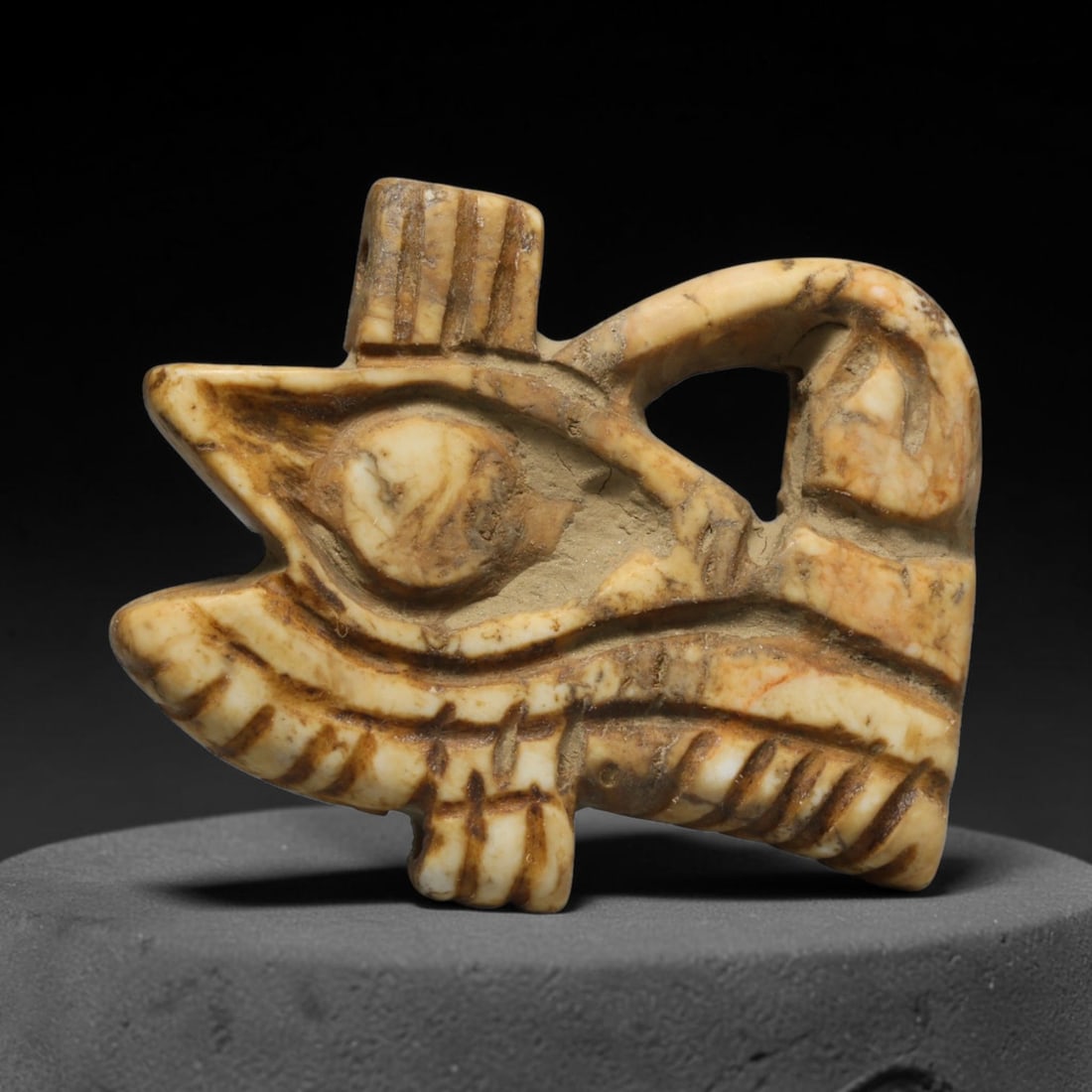 Ancient Predynastic & Pharaonic Egyptian Civilization Stone Wedjat Eye Amulet (4000 BCE-30 CE), 10ED: This ancient stone Wedjat Eye amulet originates from Predynastic & Pharaonic Egyptian Civilization, the revered emblem of protection, restoration and divine power within ancient Egyptian funerary and 