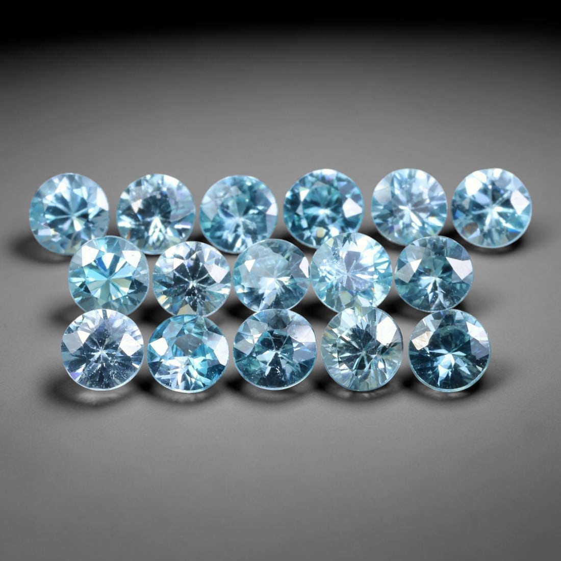 5.85ct Parcel of 16pcs Natural Brazilian Calibrated Round Sky Blue Topaz Loose Gemstones, 30BE: This matched parcel contains sixteen polished calibrated round topaz displaying clean bright sky-blue hue, with faint minor natural internal crystal features within each gemstone, uniform calibrated s