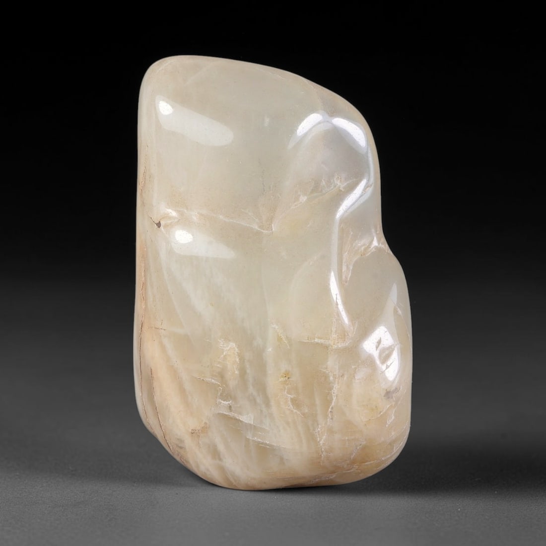 106ct Natural Ceylon Pale Cream White Moonstone Rough, 76AH: This smooth weathered moonstone rough carries soft pale cream white translucency with subtle internal silvery adularescent shimmer locked within its naturally tumbled surface, fine faint mineral veini