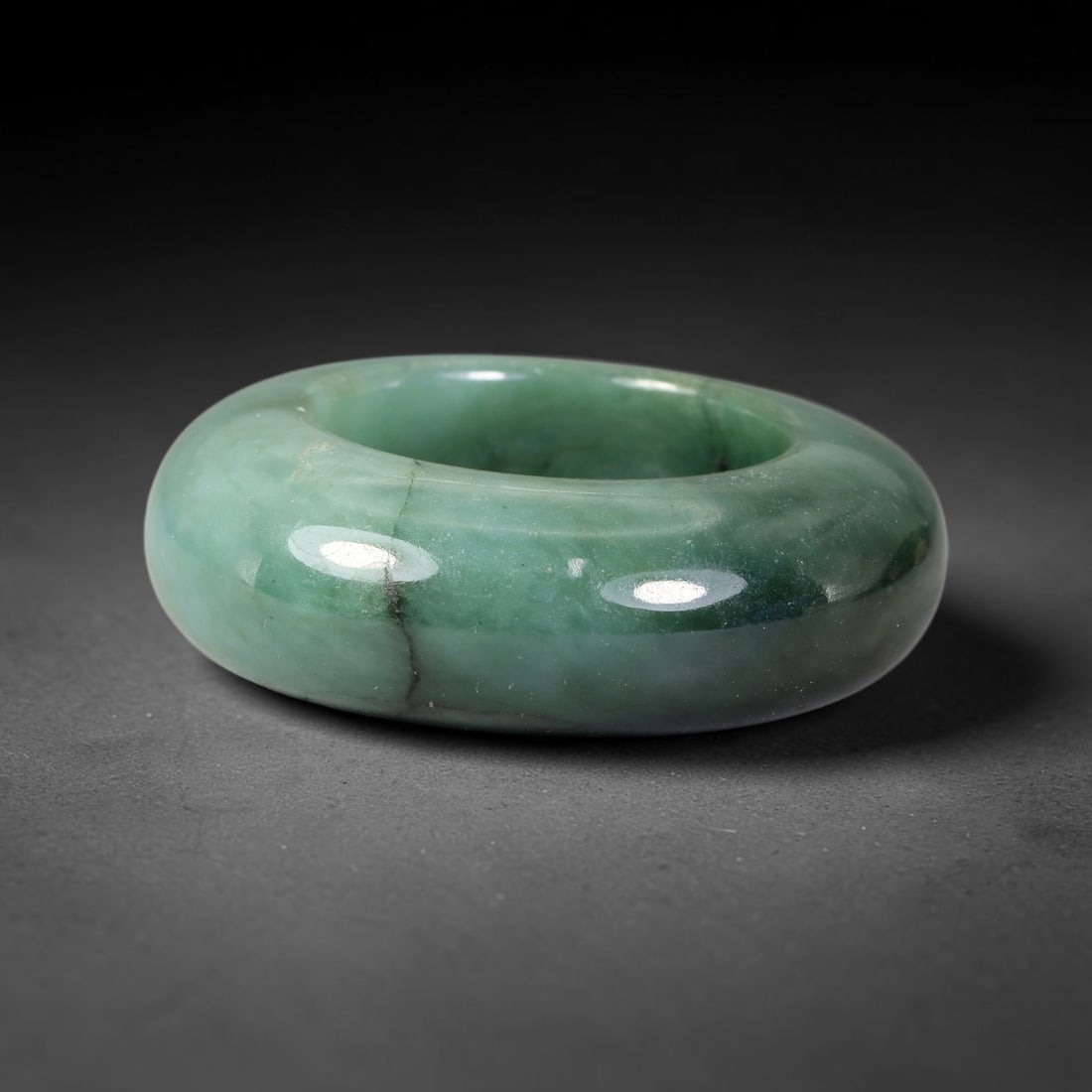 Natural Burmese Type A Jadeite Jade Wide Band Ring, 14BK: Polished untreated Burmese Type A jadeite jade wide band ring, US ring size 13 with a substantial band width of 11 mm. The jadeite features a soft pale mint green base naturally streaked with flowing 