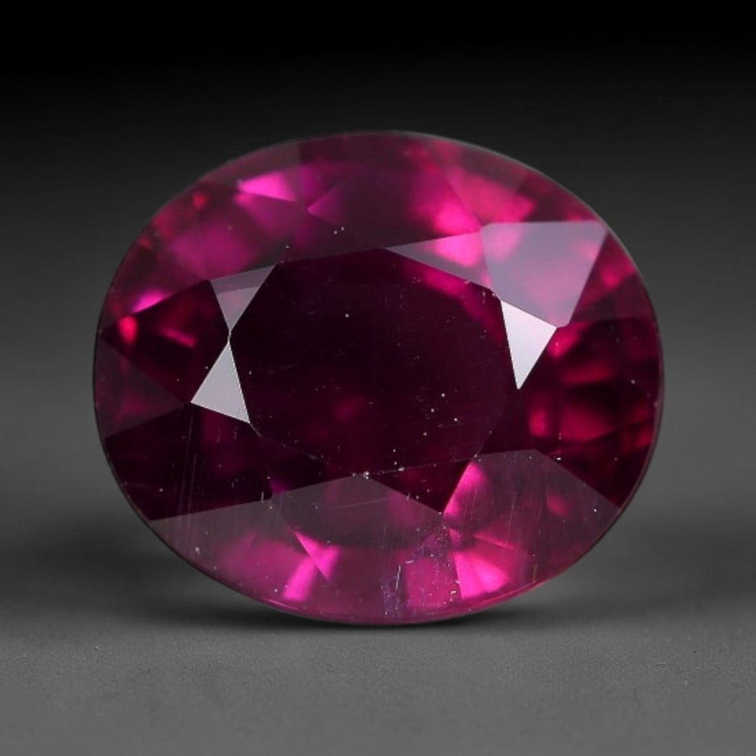 4.50 Carats Natural Mozambique Deep Fuchsia Rhodolite Garnet Loose Gemstone, 69FG: This natural Mozambique rhodolite garnet features dimensions of 10x8.8x5.8mm, holding a vivid deep fuchsia-pink color that glows brightly when light passes through its transparent body, with fine subt