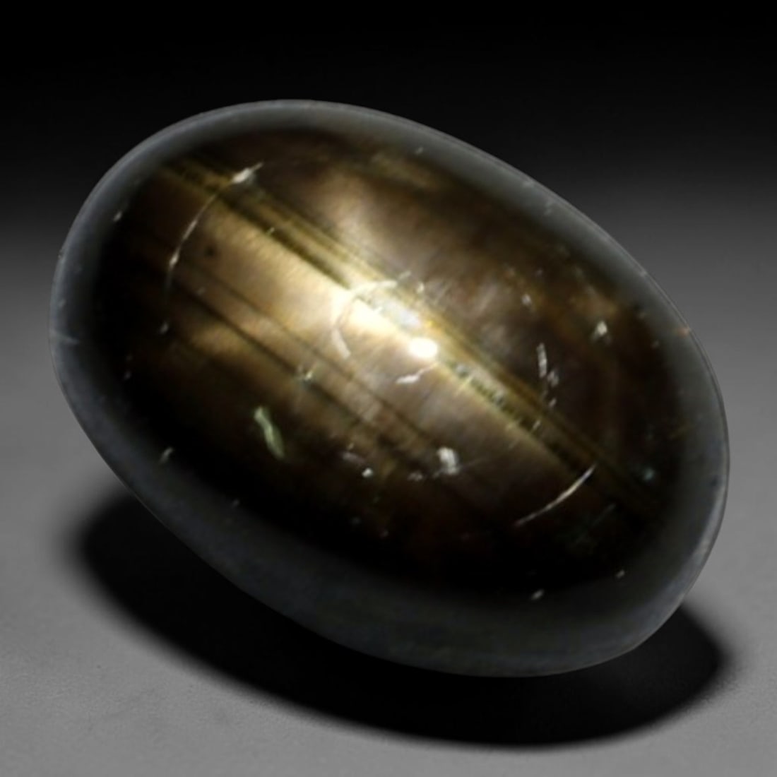 1.57ct Natural Siamese 6-Ray Black Star Sapphire Loose Gemstone, 3BD: This polished star sapphire originates from classic Siamese mining deposits, featuring a deep dark crystalline base with fine native mineral traces trapped within its structure, sized at calibrated 7x
