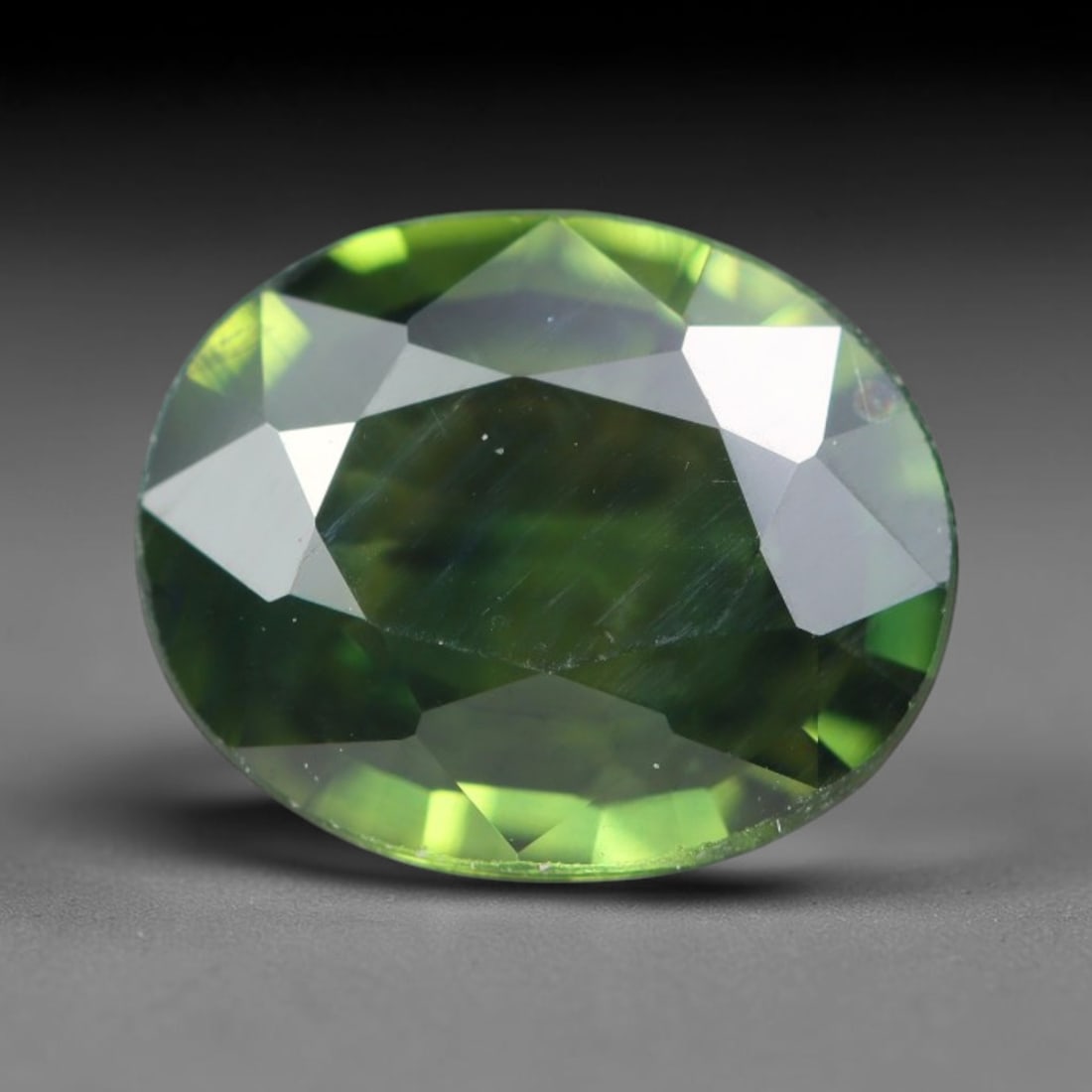 1.32ct Natural Australian Parti Sapphire Faceted Loose Gemstone, 73BA: This expertly faceted Australian parti sapphire features blended multi-tonal green-yellow internal saturation with tiny scattered microscopic mineral specks suspended within its transparent crystallin