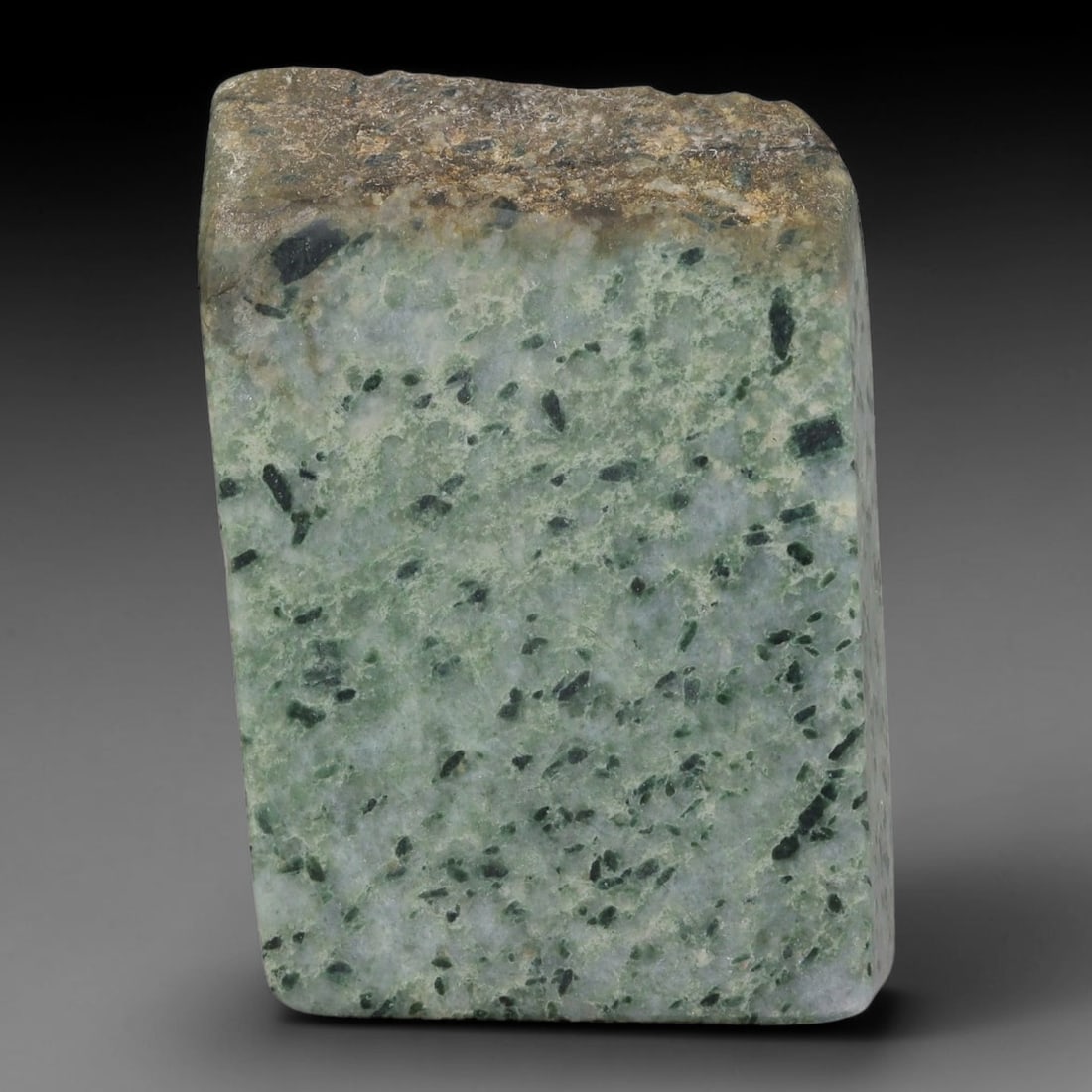 290ct Natural Type A Burmese Jadeite Jade Sliced Rough, 56FB: This specimen is a sliced rough block of natural Type A Burmese jadeite jade. The interior displays natural colour zoning with visible mineral veining and crystalline patterns typical of unprocessed j