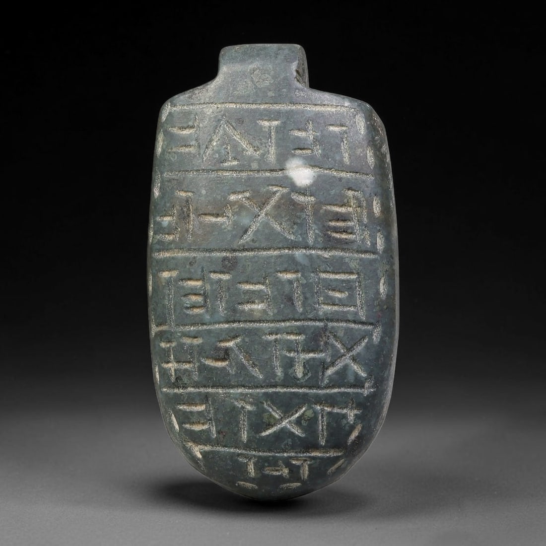Vintage Uruk Revival Carved Stone Cuneiform Talisman Pendant Plaque, 61FK: This vintage pendant is hand-carved from dark mineral stone, designed in revival style inspired by ancient Uruk glyptic traditions. The surface features neatly arranged horizontal bands of stylized cu