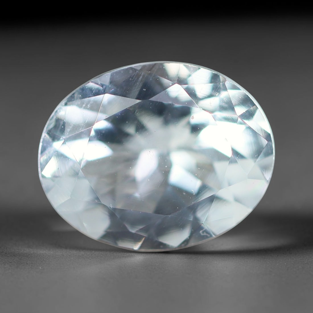 2.08ct Natural Brazilian Sky Blue Faceted Aquamarine Loose Gemstone, 6BF: This precisely faceted aquamarine boasts clear translucent pale sky blue body tone with subtle thin mineral needle and tiny scattered crystalline specks visible within its polished reflective planes i