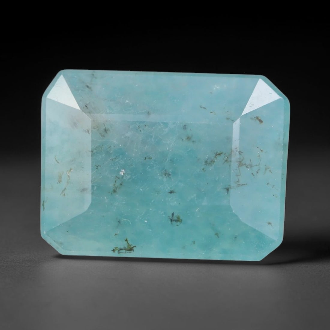 5.70ct Natural Madagascan Faceted Grandidierite Rare Loose Gemstone, 62BD: This expertly faceted finished grandidierite holds soft translucent body tone with fine faint natural internal veining visible beneath precisely cut reflective facets within its 13.1x10x5.7mm calibrat