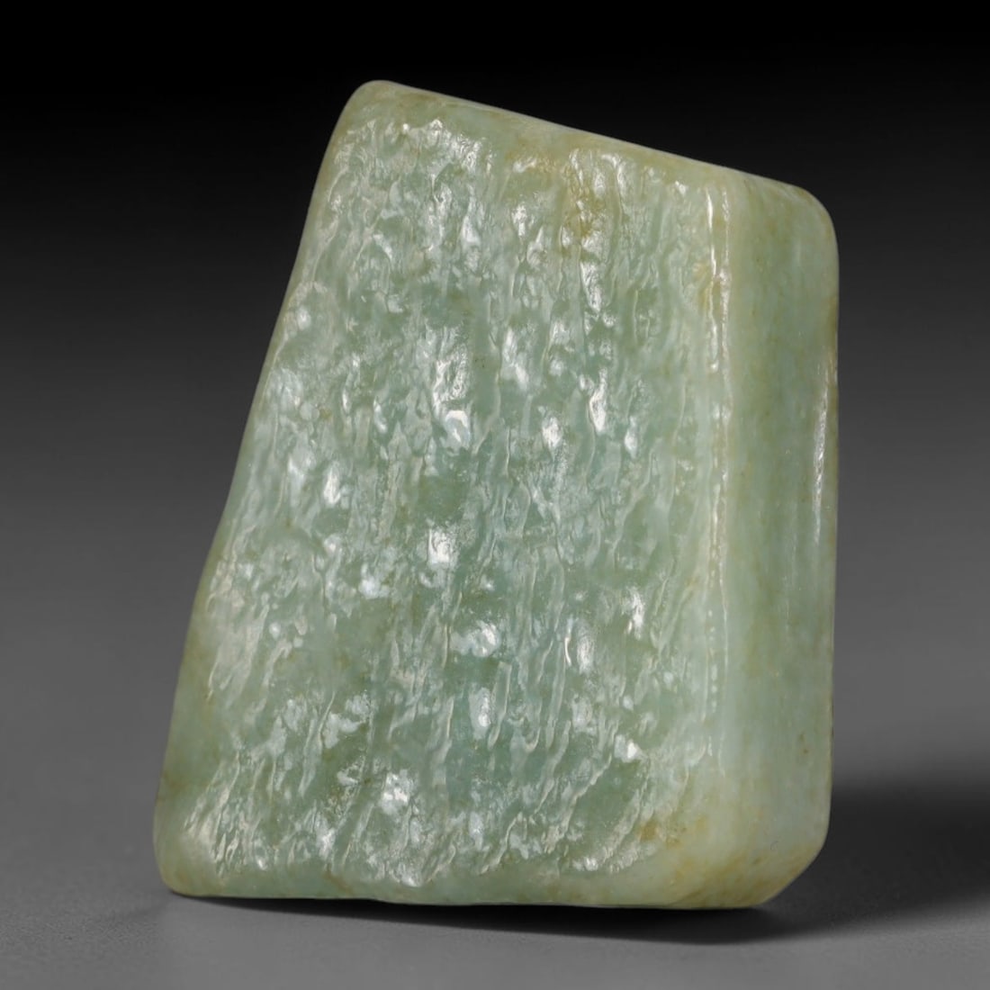 240ct Natural Type A Burmese Jadeite Jade Polished Sliced Rough, 80AZ: This specimen is a sliced rough block of natural Type A Burmese jadeite jade. The interior displays natural colour zoning with visible mineral veining and crystalline patterns typical of unprocessed j