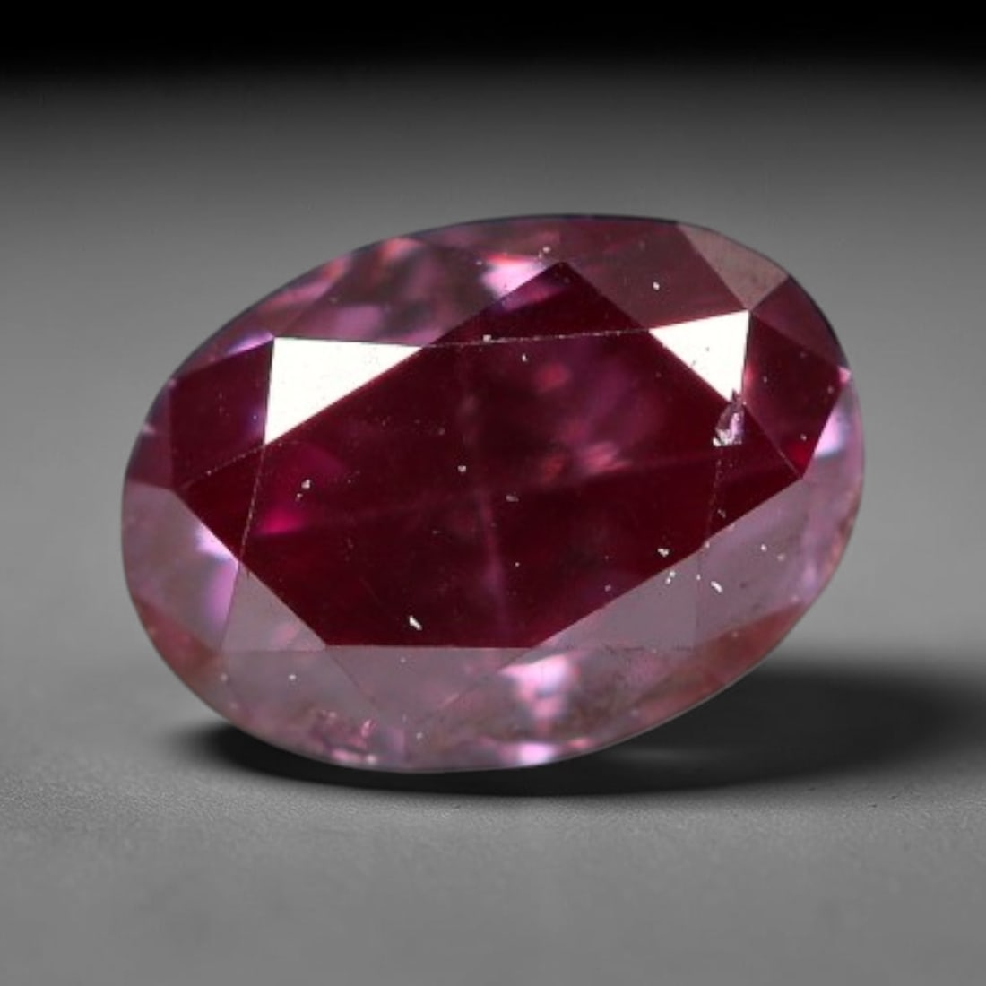 0.19ct Natural Fancy Pinkish Purple Diamond Loose Gemstone, 27BG: This polished natural diamond displays rich pinkish-purple body saturation, with subtle fine microscopic mineral specks distributed within its crystal interior, measured at calibrated dimensions of 4x