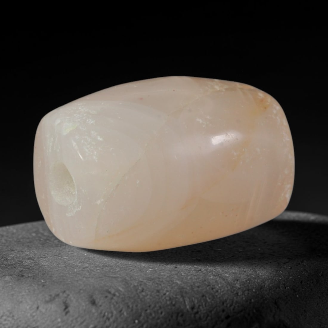Ancient Akkadian Civilization Banded Agate Barrel Bead (2334-2154 BCE), 39AD: This antique banded agate barrel bead originates from the Akkadian Civilization, the earliest unified Mesopotamian imperial culture that carried forward Sumerian agate bead and cylinder seal carving t