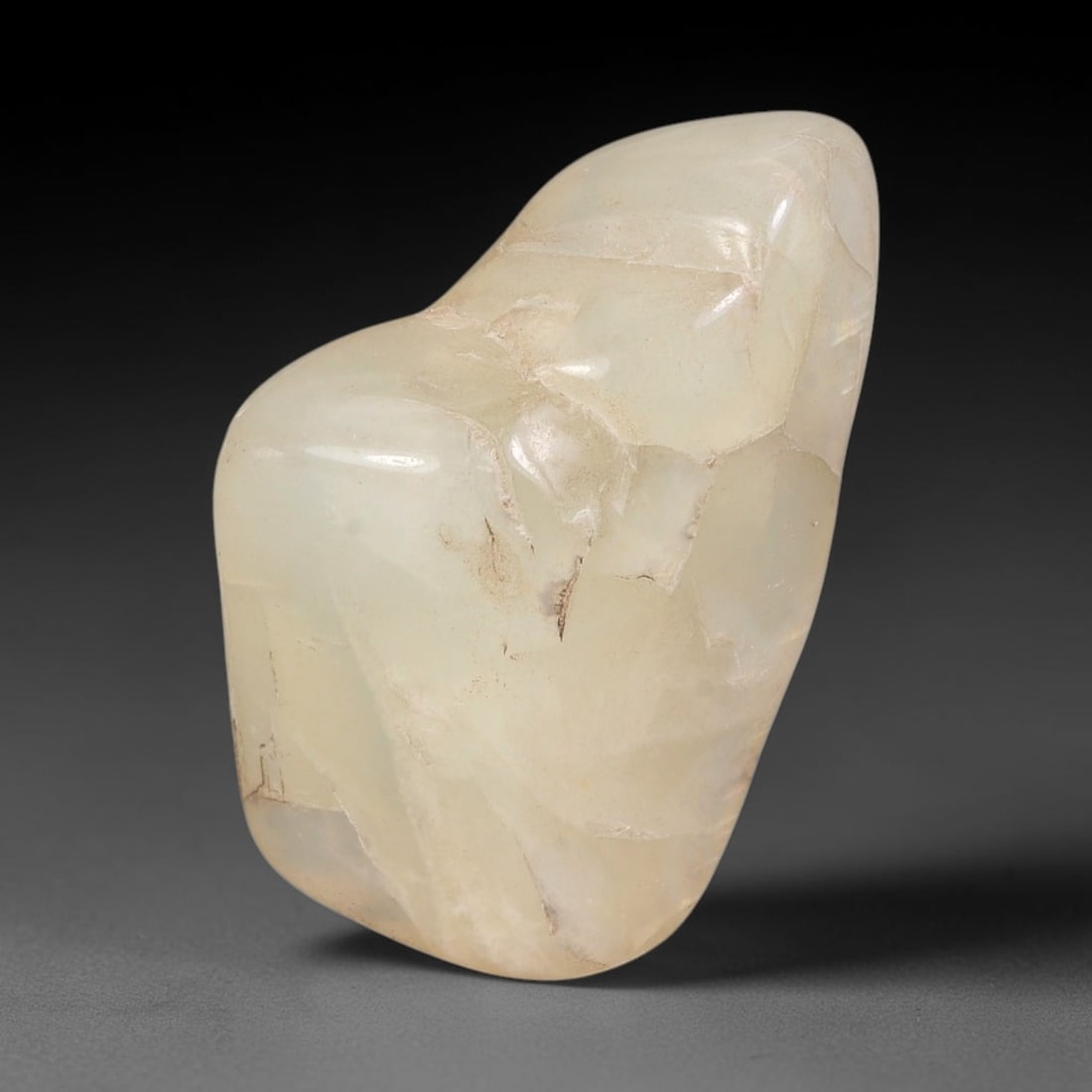 47ct Natural Ceylon Pale Cream White Moonstone Rough, 66AH: This smooth weathered moonstone rough carries soft pale cream white translucency with subtle internal silvery adularescent shimmer locked within its naturally tumbled surface, fine faint mineral veini